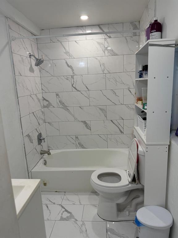 1116 West 32nd Street Riviera Beach, FL 33404 - Photo 11 of 12 a bathroom with a toilet and a shower