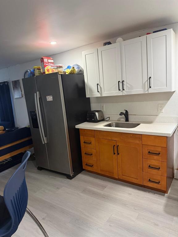 1116 West 32nd Street Riviera Beach, FL 33404 - Photo 3 of 12 a kitchen with stainless steel appliances granite countertop a refrigerator and a sink