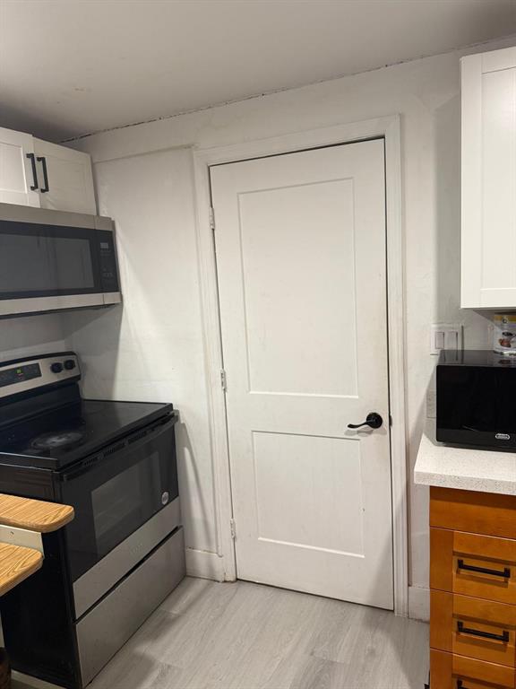 1116 West 32nd Street Riviera Beach, FL 33404 - Photo 4 of 12 a view of kitchen and utility room