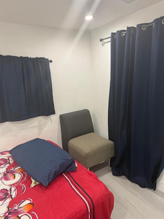 1116 West 32nd Street Riviera Beach, FL 33404 - Photo 7 of 12 a bedroom with two beds and a closet