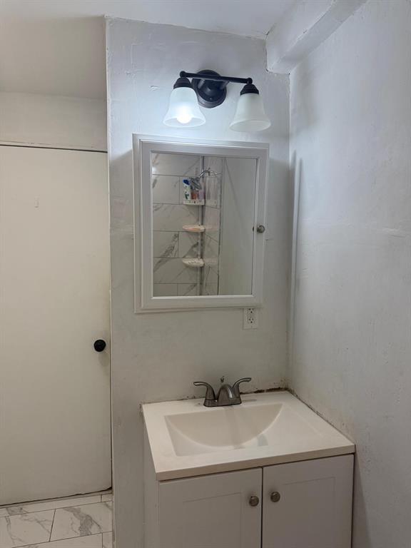 1116 West 32nd Street Riviera Beach, FL 33404 - Photo 9 of 12 a bathroom with a sink and cabinets