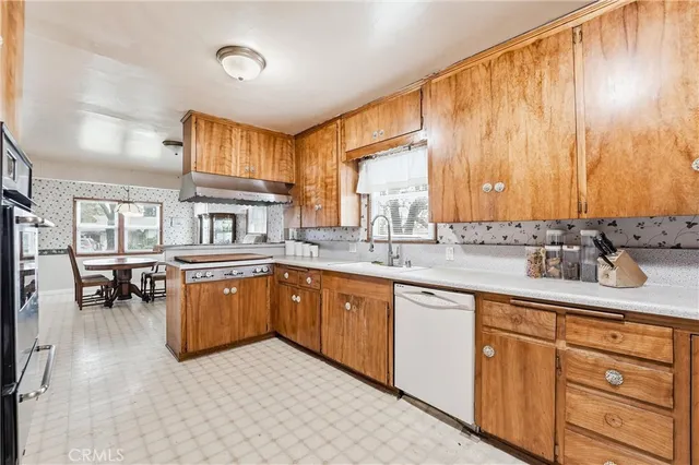 a kitchen with sink cabinets and window