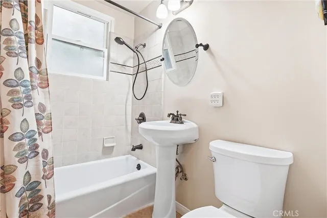 a bathroom with a sink a toilet and a bathtub