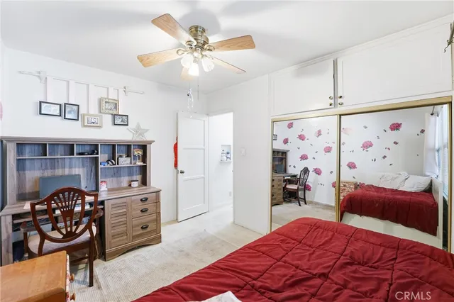 a bedroom with furniture and a chandelier