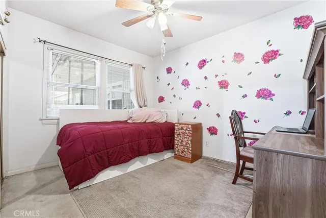 a bedroom with furniture and a window