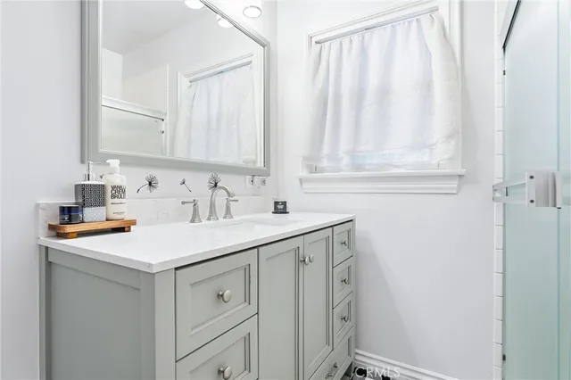 a utility room with cabinets washer and dryer