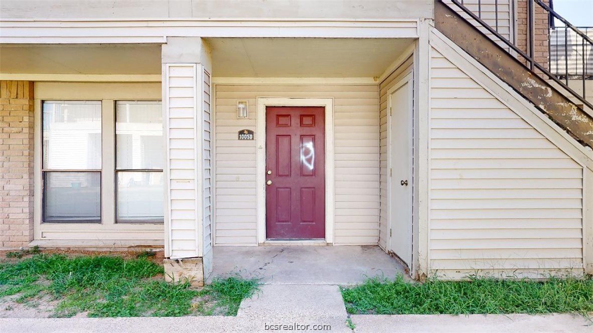 1005 Spring Loop, Unit D College Station, TX 77840 - Photo 2 of 25 a front view of a house with a garage