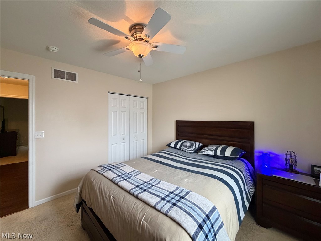 1343 Courtland Road Weirton, WV 26062 - Photo 30 of 50 Bedroom featuring light colored carpet, a ceiling fan, and a closet