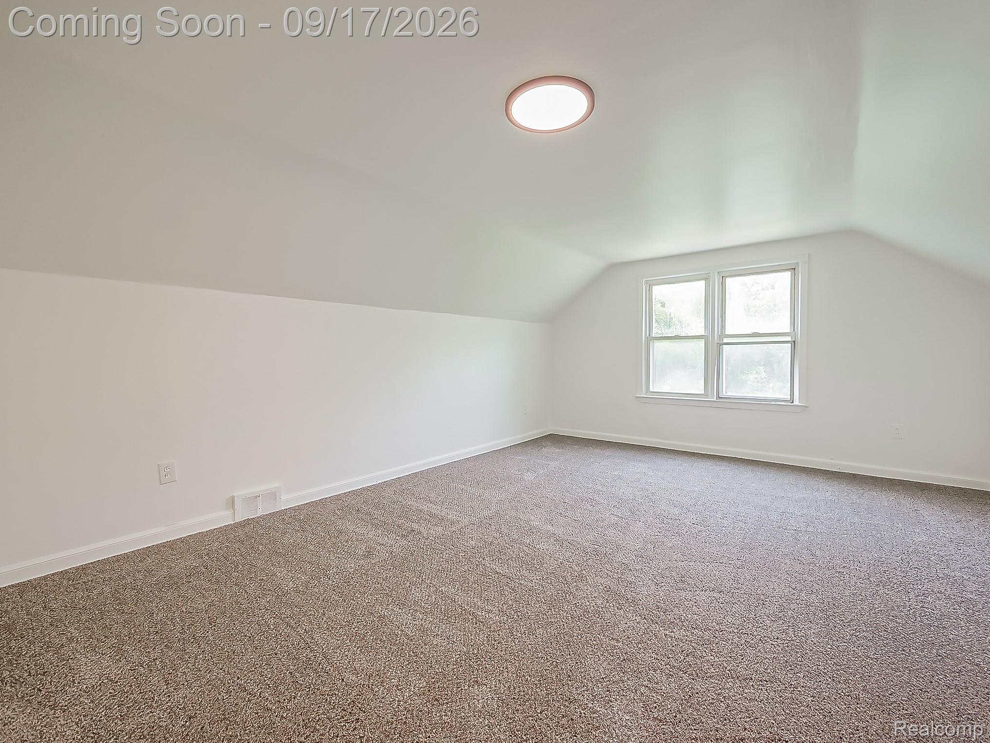 14102 Toepfer Road Warren, MI 48089 - Photo 14 of 39 Carpeted room with a pitched ceiling, double window, and flush-mount ceiling light