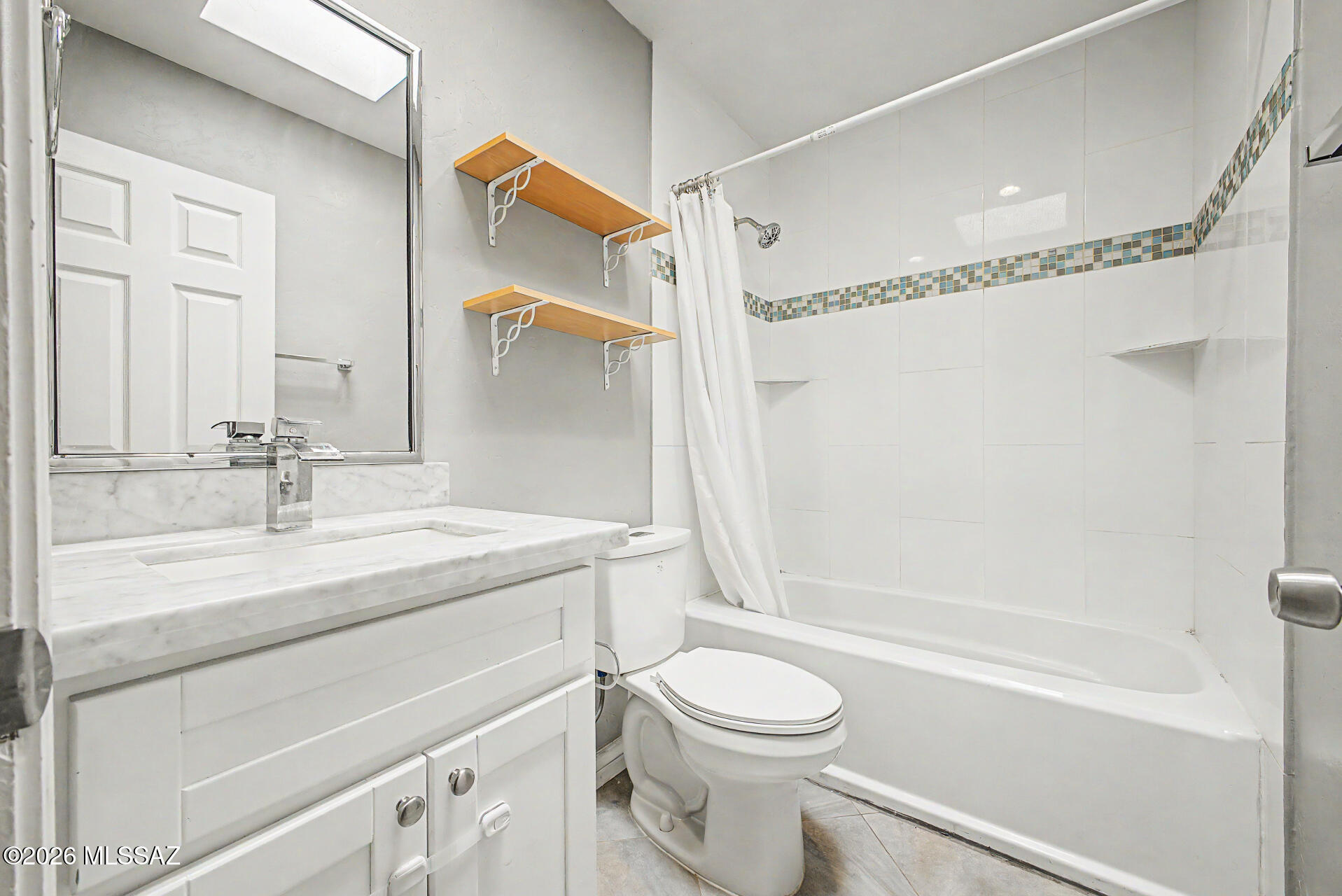 7550 East Rio Verde Drive Tucson, AZ 85715 - Photo 20 of 25 The skylight fills the guest bathroom with beautiful natural light, adding brightness throughout the day.