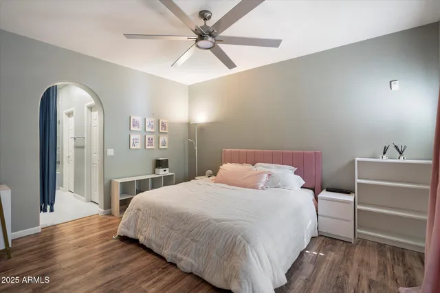 a bedroom with a bed and a window