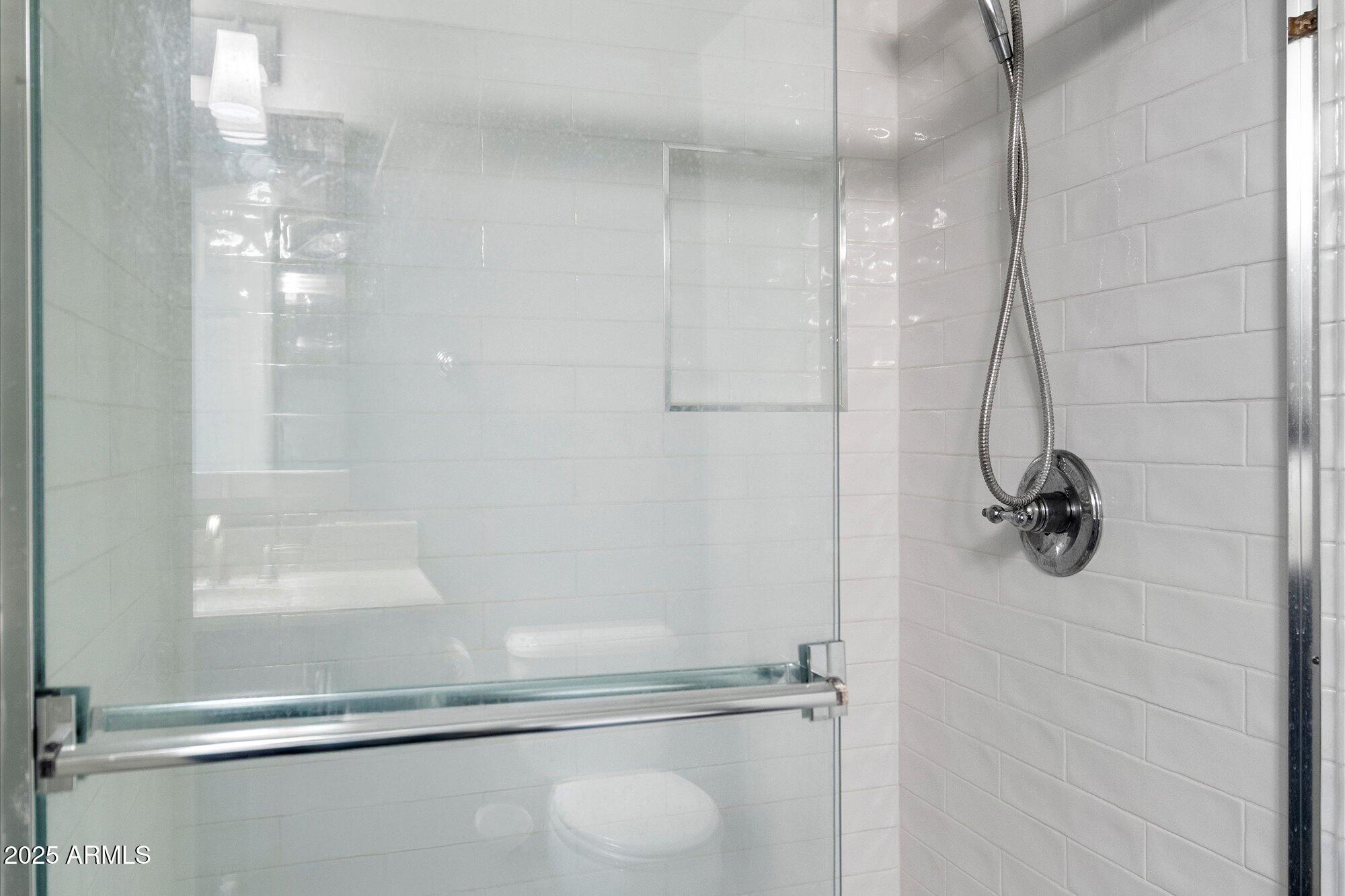 3935 East Rough Rider Road, Unit 1164 Phoenix, AZ 85050 - Photo 18 of 20 a bathroom with a shower