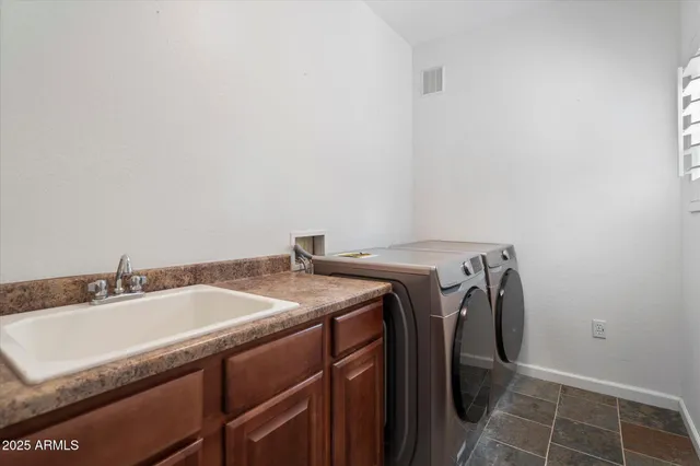 a view of a chair and table on the deck