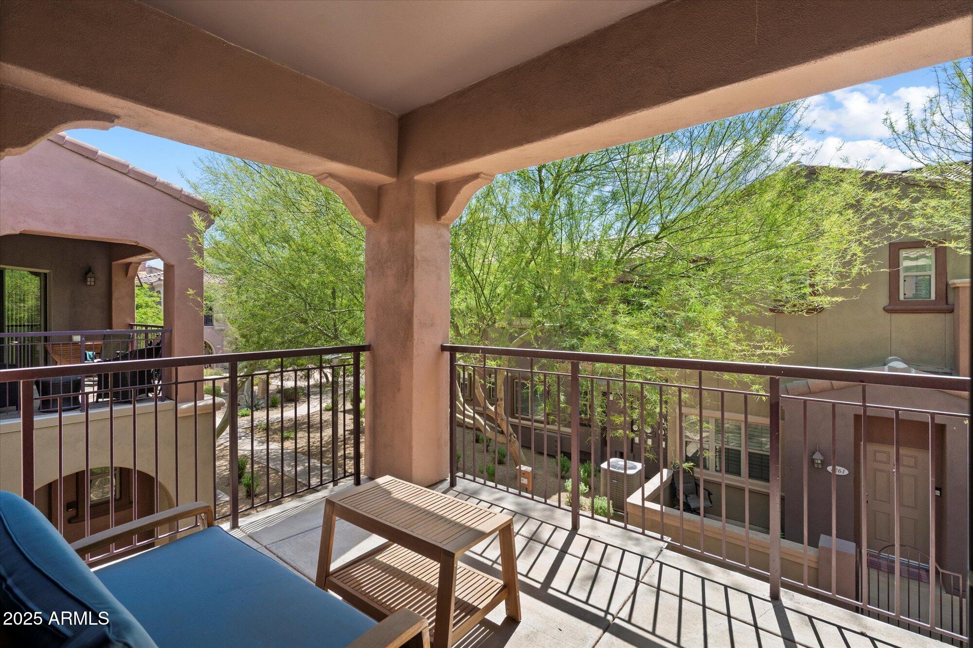 3935 East Rough Rider Road, Unit 1164 Phoenix, AZ 85050 - Photo 20 of 20 a view of a chair and table on the deck