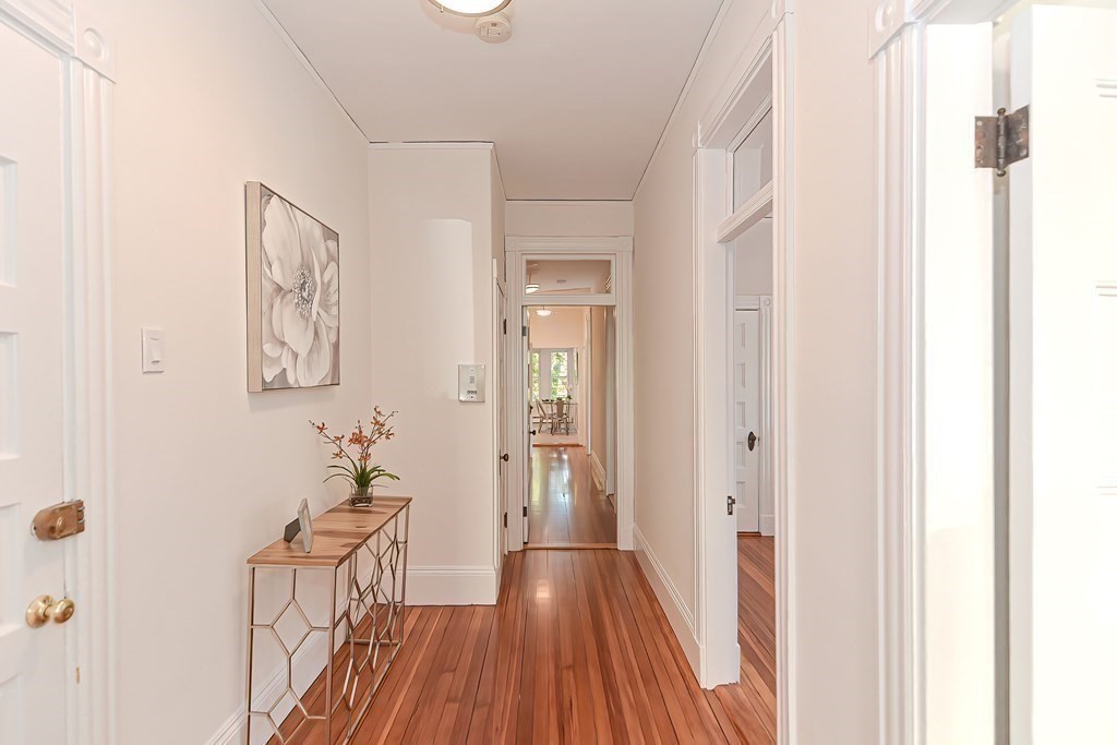 28 Inman Street, Unit 2 Cambridge, MA 02139 - Photo 20 of 24 a view of a hallway with wooden floor and closet