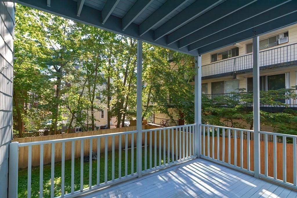 28 Inman Street, Unit 2 Cambridge, MA 02139 - Photo 22 of 24 a view of a wooden house with a porch