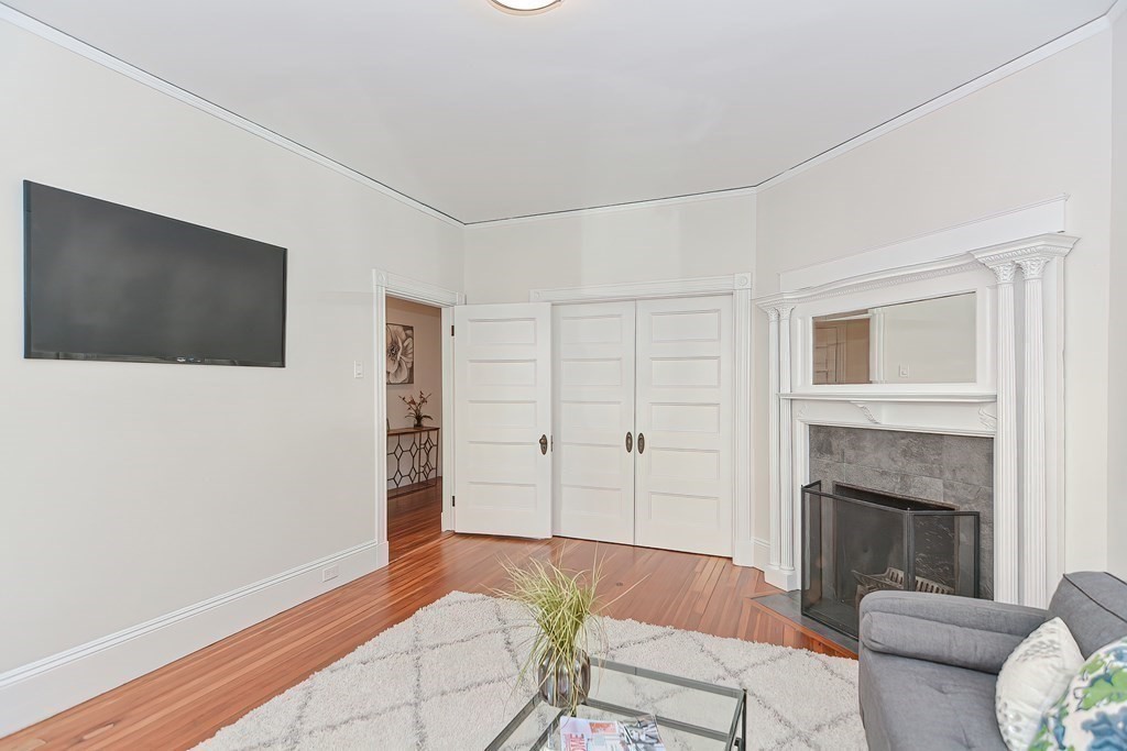 28 Inman Street, Unit 2 Cambridge, MA 02139 - Photo 3 of 24 a living room with furniture and a flat screen tv