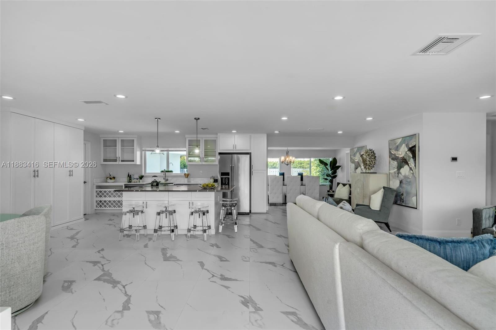 465 Northwest 11th Street Boca Raton, FL 33432 - Photo 11 of 50 a large white kitchen with lots of counter space