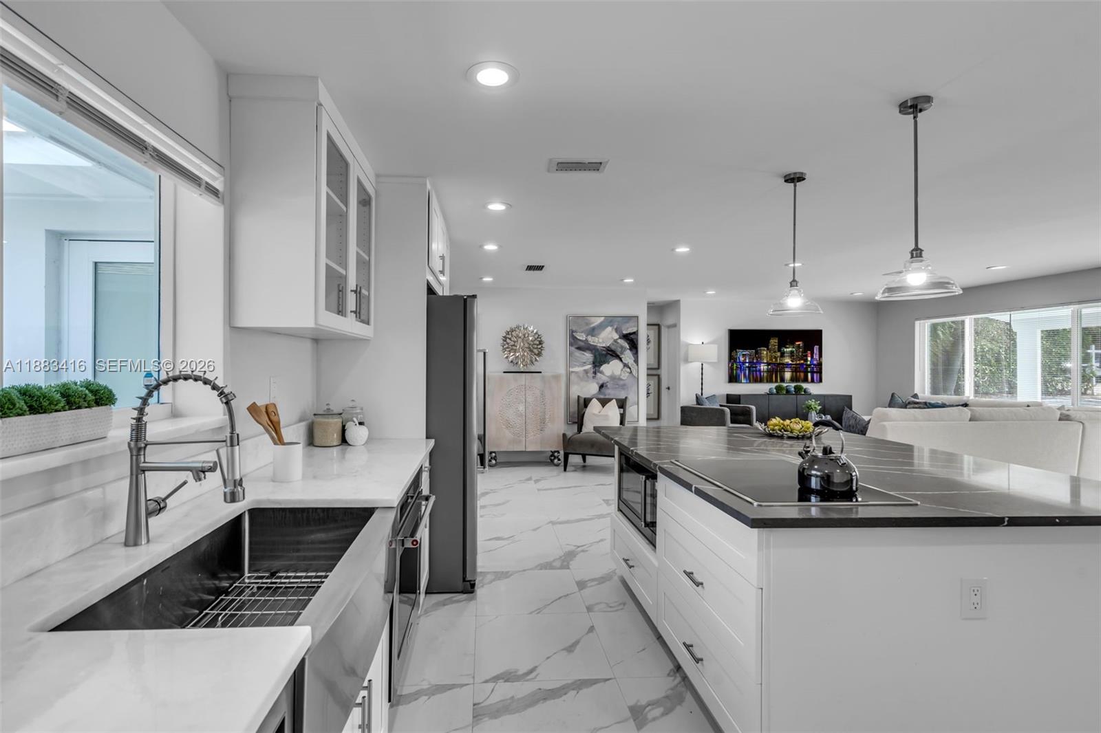 465 Northwest 11th Street Boca Raton, FL 33432 - Photo 14 of 50 a large kitchen with stainless steel appliances lots of counter space and a sink
