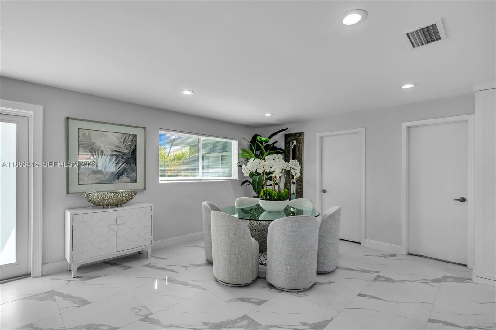 465 Northwest 11th Street Boca Raton, FL 33432 - Photo 17 of 50 a living room with furniture and a potted plant