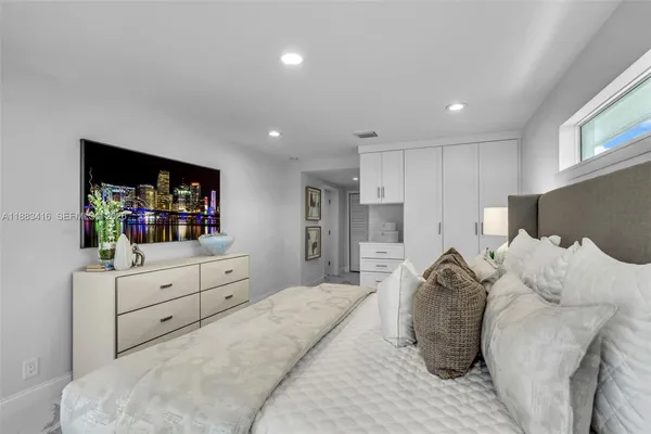 a bed room with a bed and a television