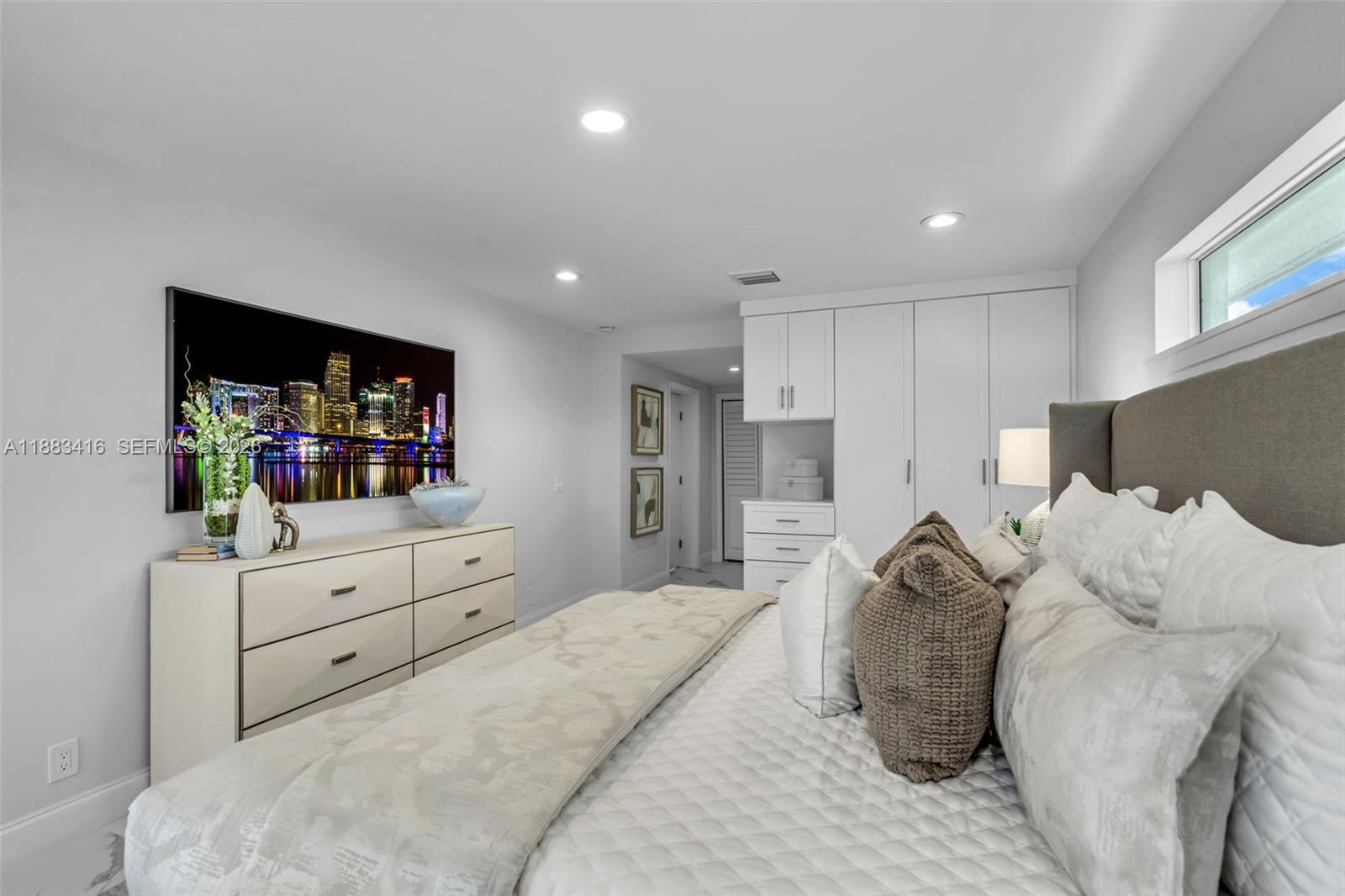 465 Northwest 11th Street Boca Raton, FL 33432 - Photo 22 of 50 a bed room with a bed and a television