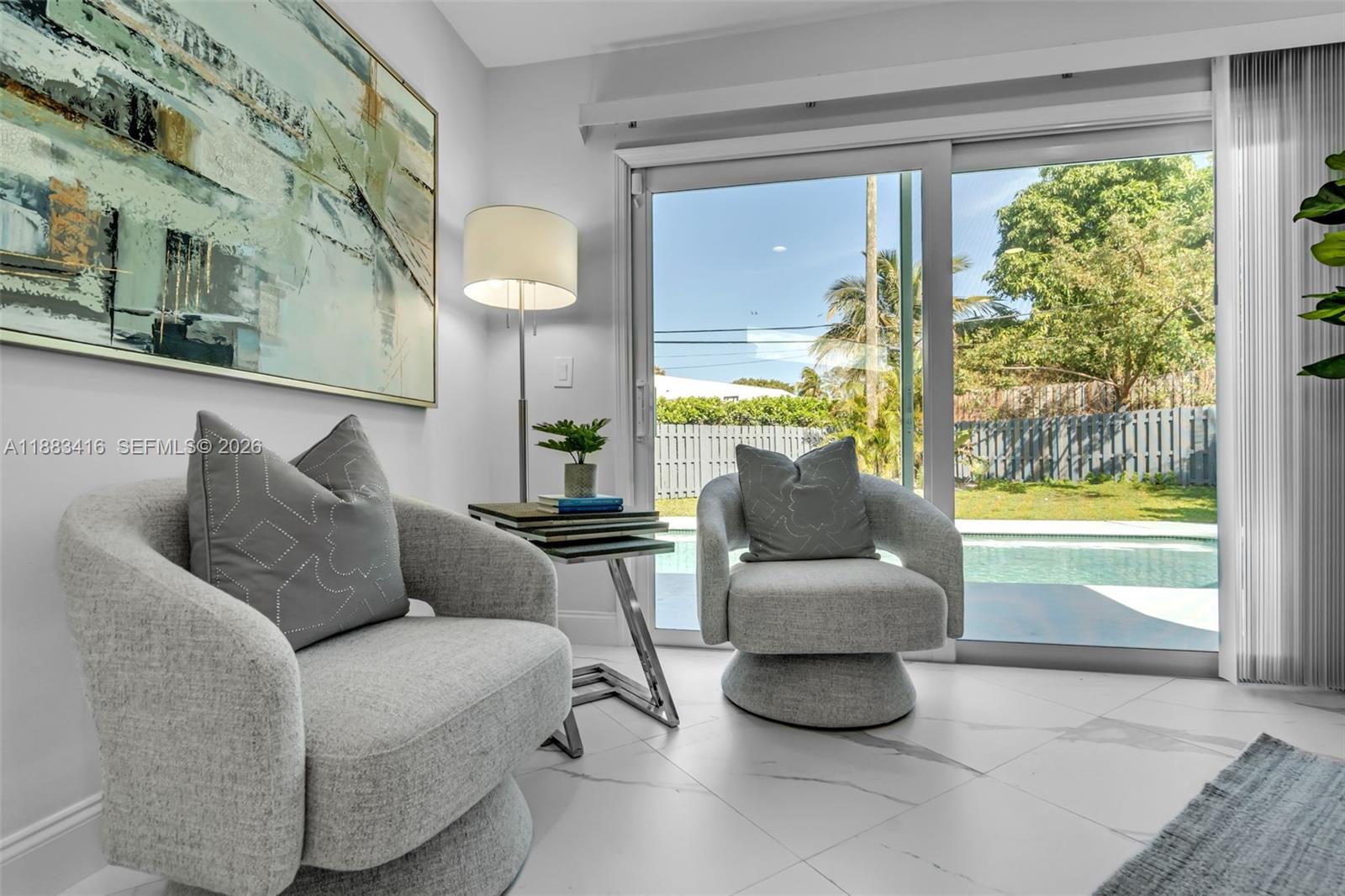 465 Northwest 11th Street Boca Raton, FL 33432 - Photo 23 of 50 a living room with furniture and a large window