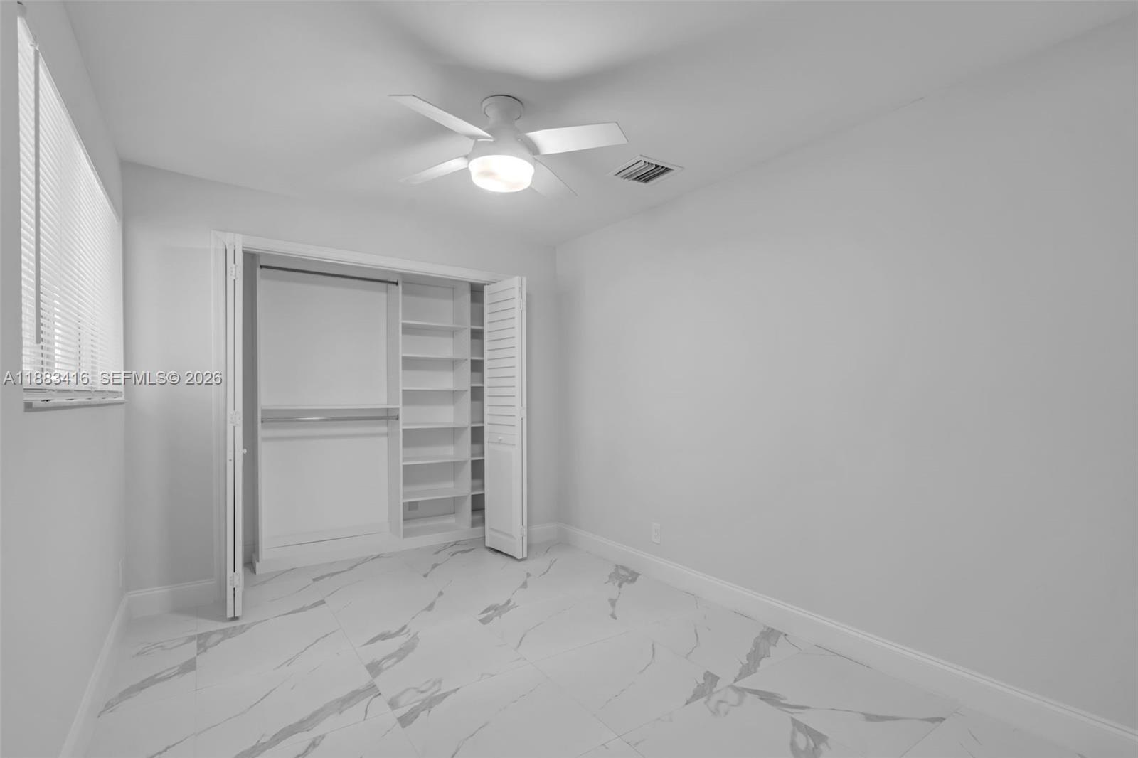 465 Northwest 11th Street Boca Raton, FL 33432 - Photo 27 of 50 wooden floor in an empty room