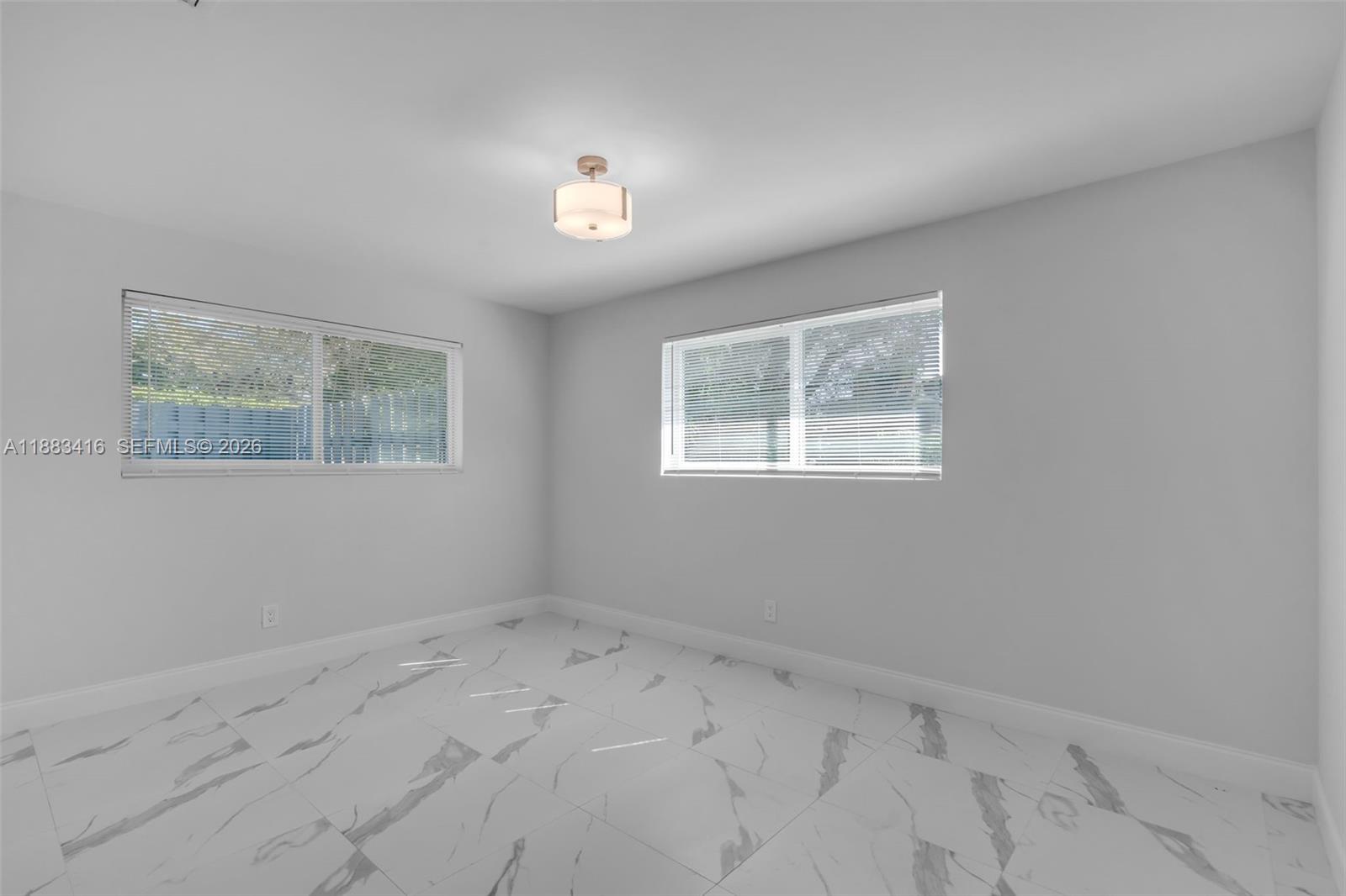465 Northwest 11th Street Boca Raton, FL 33432 - Photo 28 of 50 a view of an empty room with a window