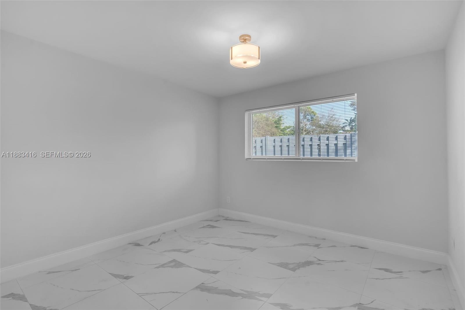 465 Northwest 11th Street Boca Raton, FL 33432 - Photo 30 of 50 an empty room with a window