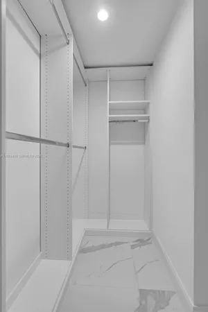 a view of an empty walk in closet