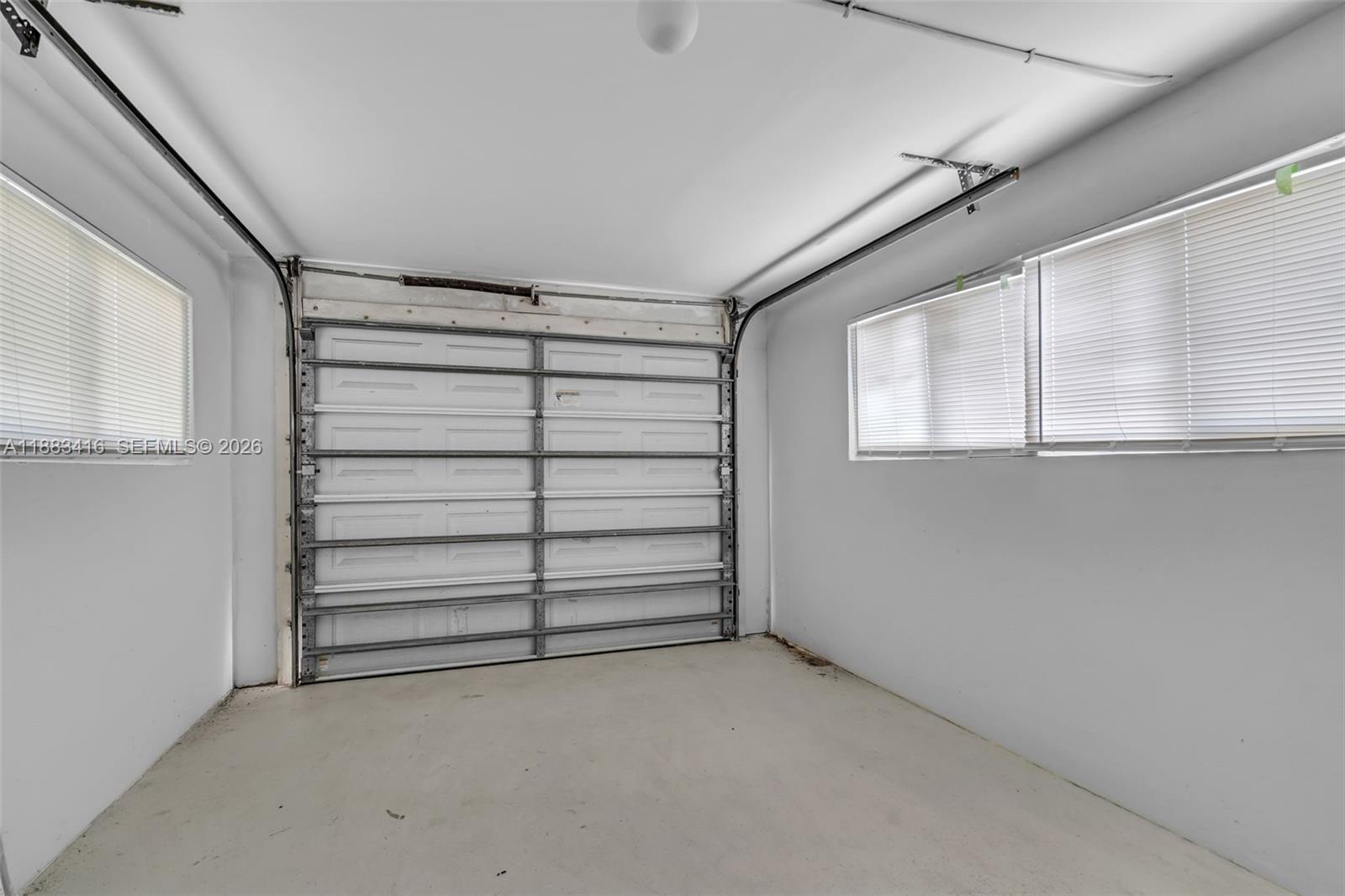 465 Northwest 11th Street Boca Raton, FL 33432 - Photo 35 of 50 a view of closet area with empty racks