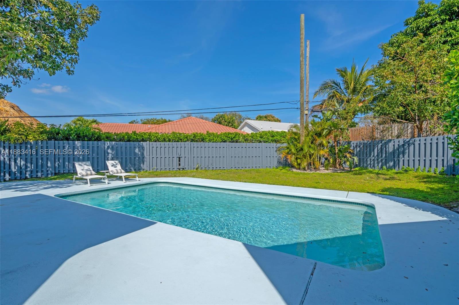 465 Northwest 11th Street Boca Raton, FL 33432 - Photo 36 of 50 a view of a swimming pool with a yard