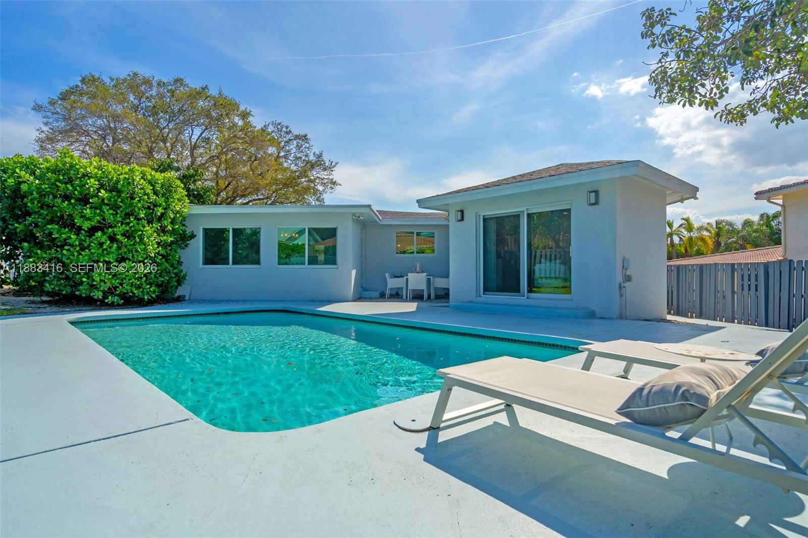 465 Northwest 11th Street Boca Raton, FL 33432 - Photo 39 of 50 a view of a house with backyard porch and sitting area