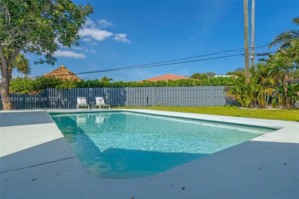 a view of a swimming pool with a patio
