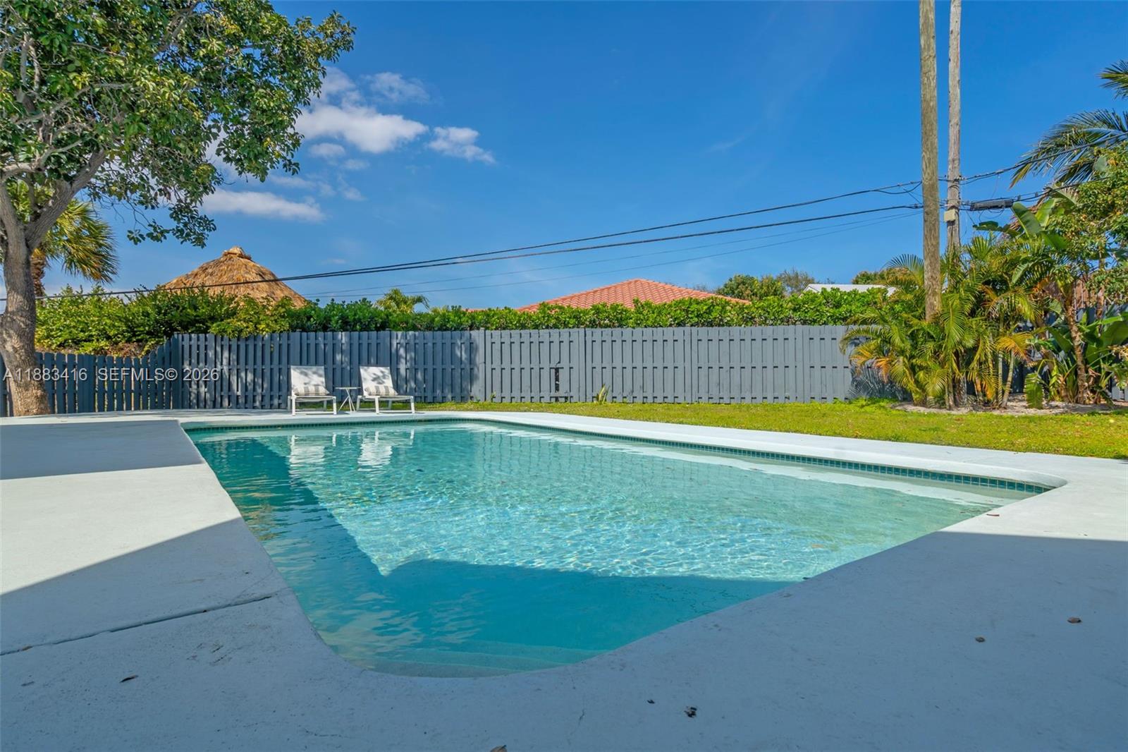 465 Northwest 11th Street Boca Raton, FL 33432 - Photo 40 of 50 a view of a swimming pool with a patio