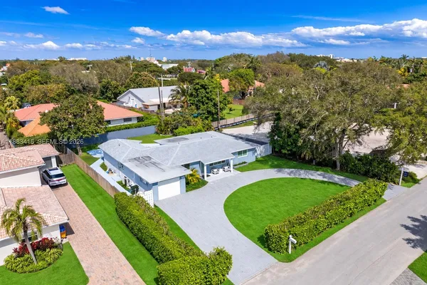 an aerial view of a house with a garden