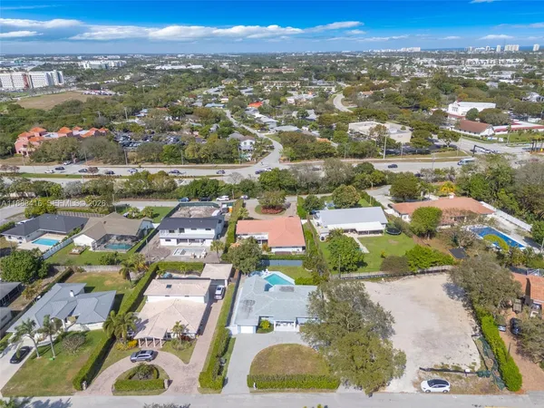 an aerial view of residential houses with outdoor space