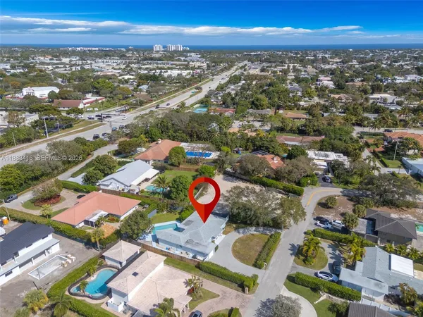 an aerial view of residential houses with outdoor space