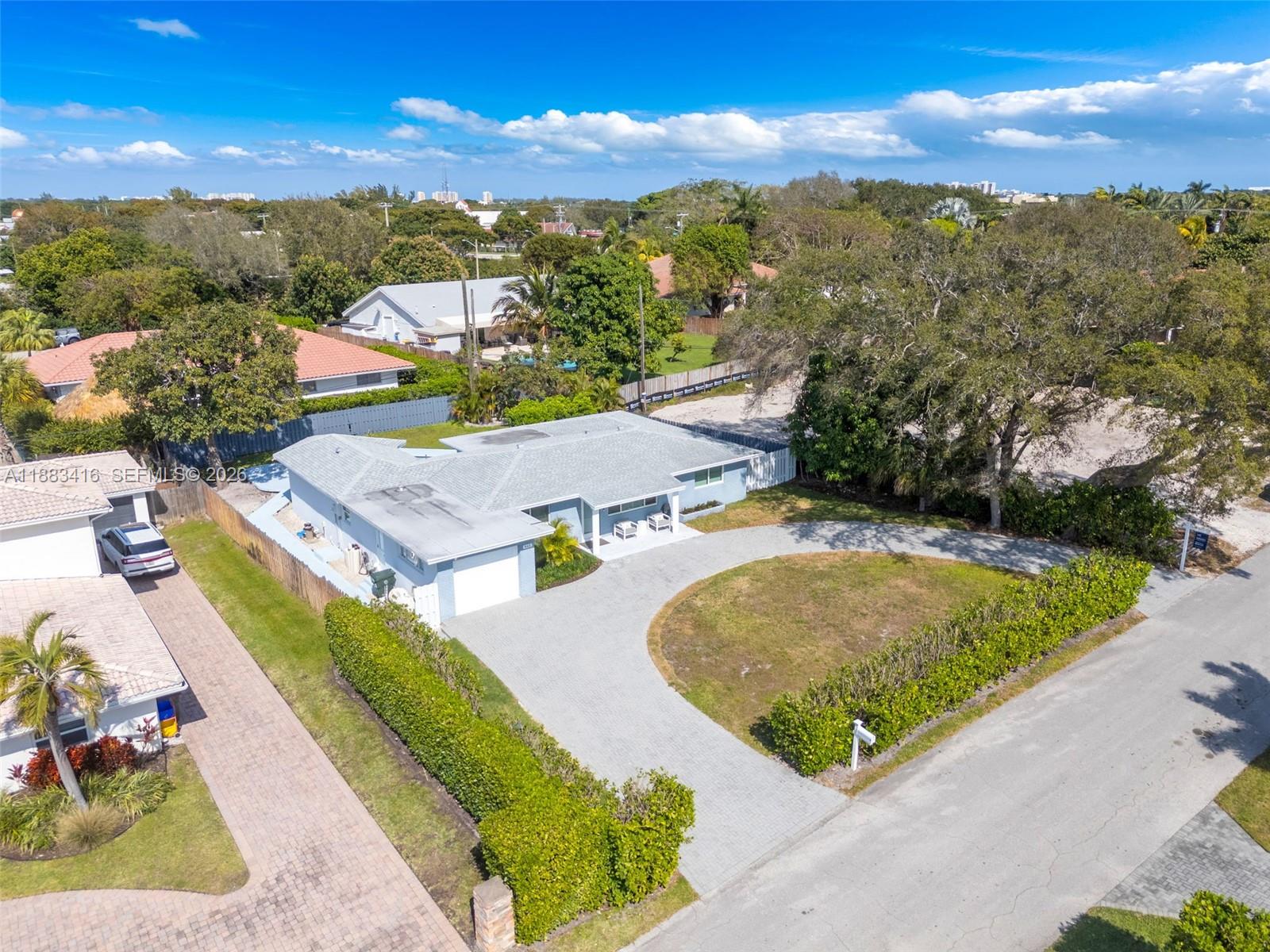 465 Northwest 11th Street Boca Raton, FL 33432 - Photo 50 of 50 an aerial view of residential houses with outdoor space and swimming pool