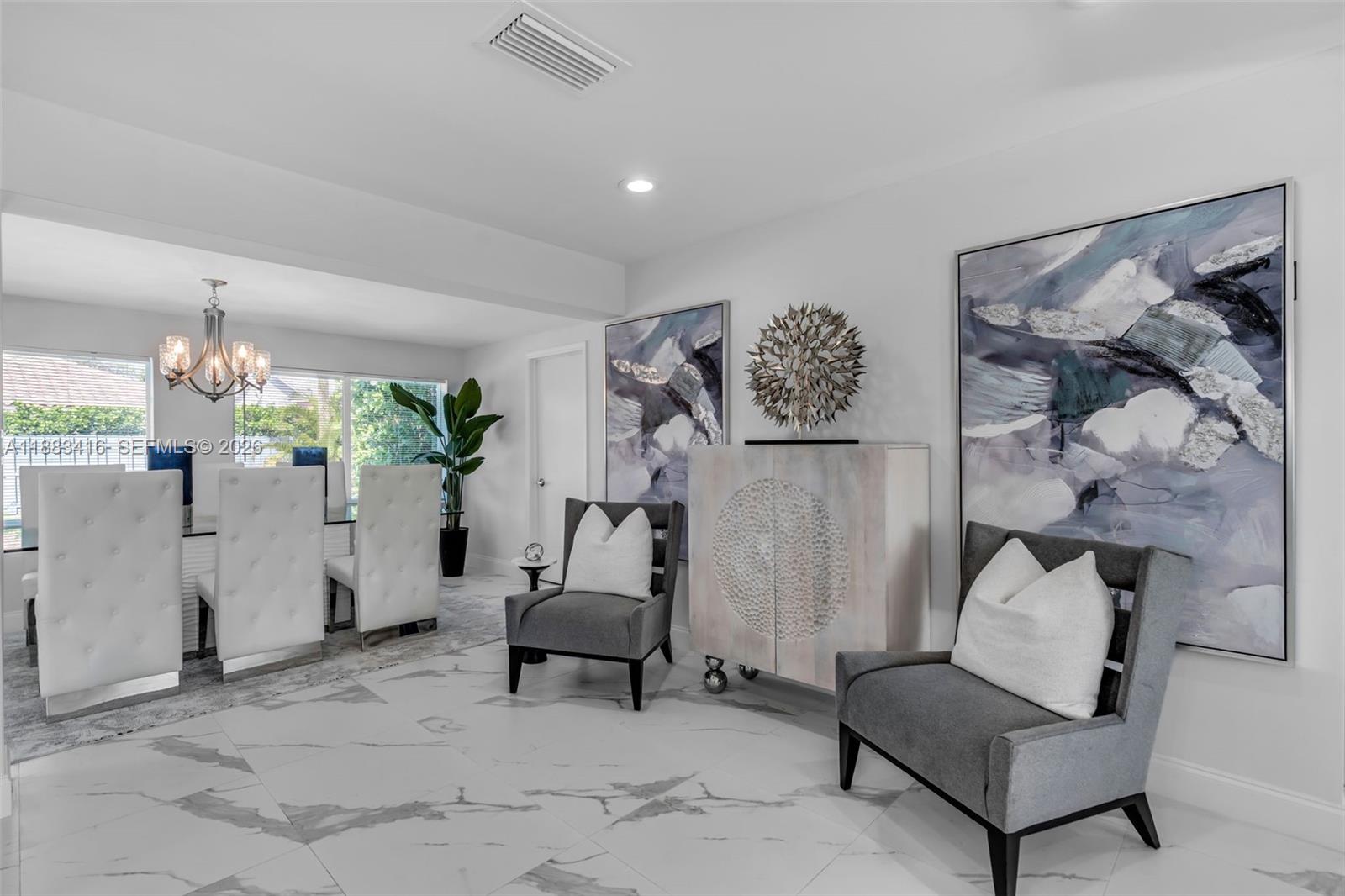 465 Northwest 11th Street Boca Raton, FL 33432 - Photo 5 of 50 a living room with furniture and a potted plant