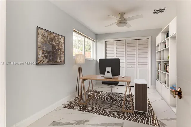 a workspace with furniture and a window