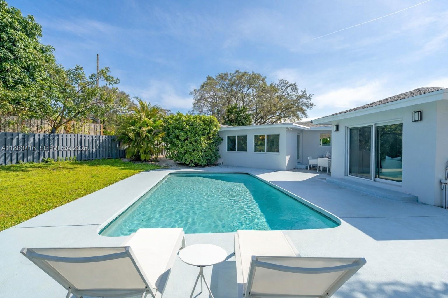 465 Northwest 11th Street Boca Raton, FL 33432 - Photo 7 of 50 a view of yard with swimming pool and porch