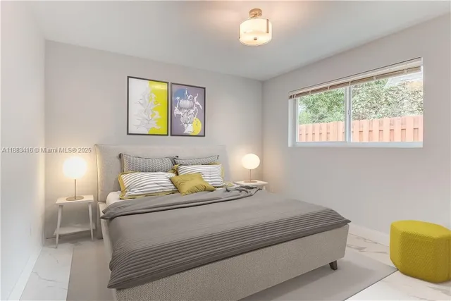 a bedroom with a bed and a lamp