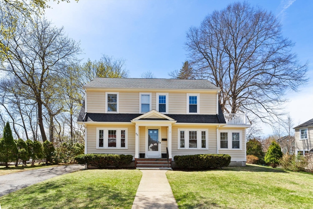 a front view of a house with a yard