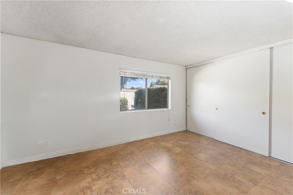 14802 Newport Avenue, Unit 18A Tustin, CA 92780 - Photo 17 of 27 an empty room with a window