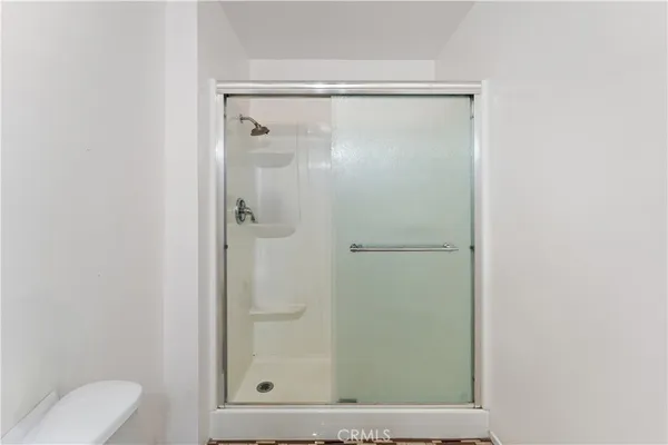 an empty room with a fan