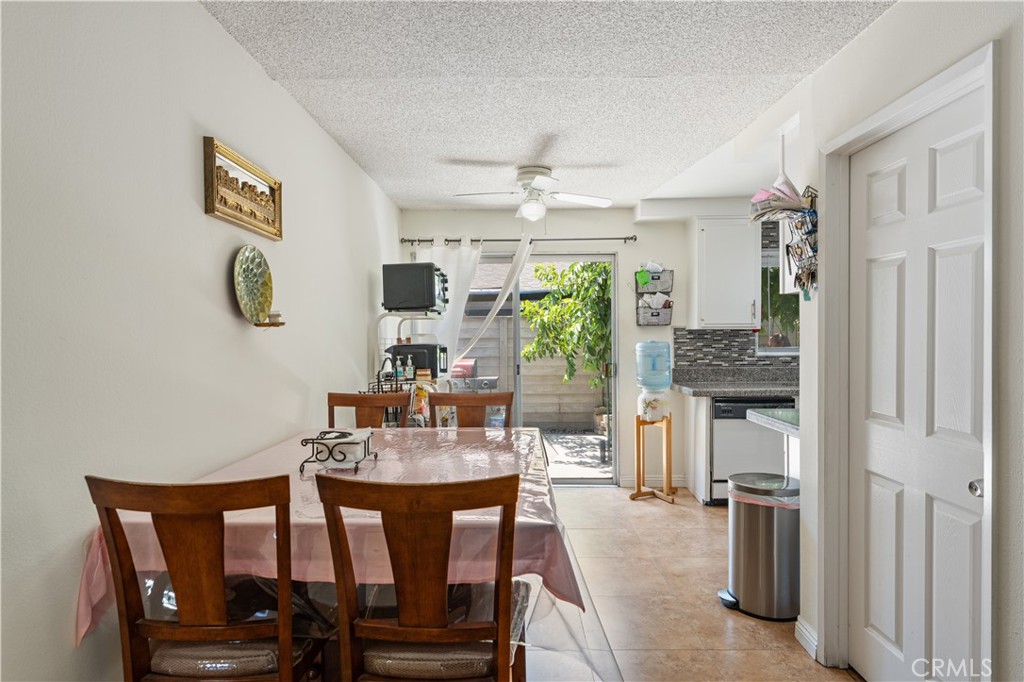 14802 Newport Avenue, Unit 18A Tustin, CA 92780 - Photo 6 of 27 a dining room with furniture and window