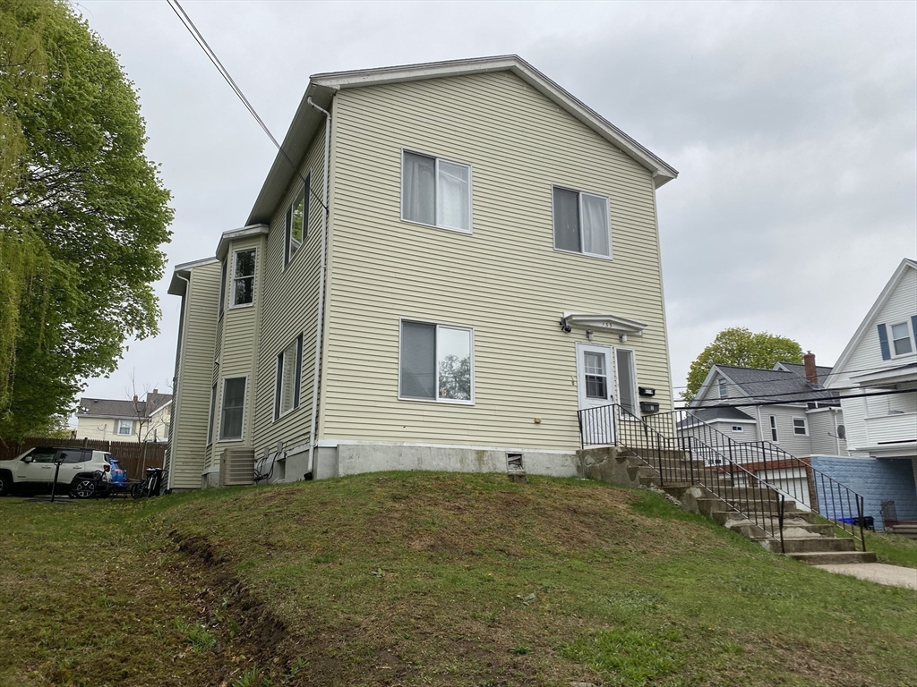 133 Walnut Street, Unit 2 Malden, MA 02148 - Photo 9 of 10 a view of a house with a yard
