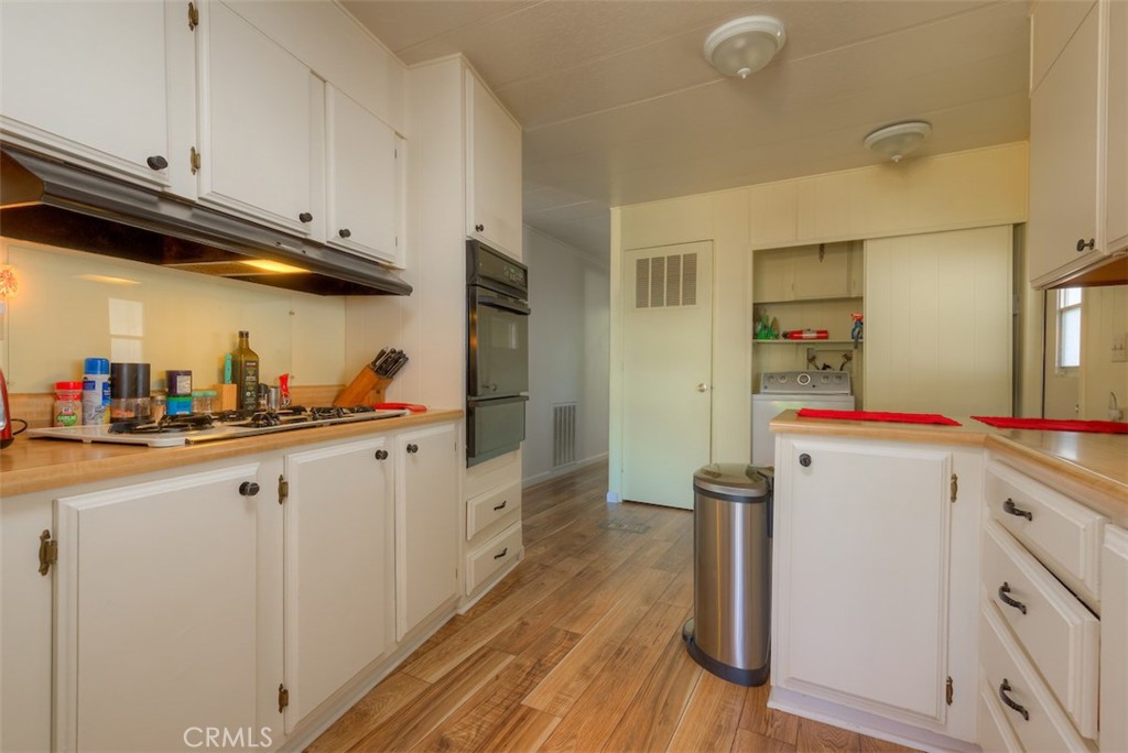 1901 Dayton Road, Unit 133 Chico, CA 95928 - Photo 15 of 36 a kitchen with cabinets a sink and appliances